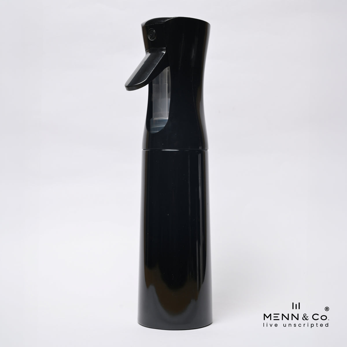 A glossy black spray bottle with a trigger nozzle and a clear water reservoir, shown against a plain white background with a 'MENN & CO' watermark in the bottom right corner.
