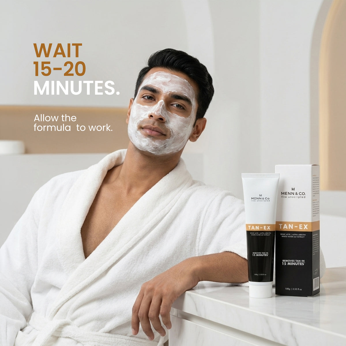 Man applying facial mask with skincare products on a counter