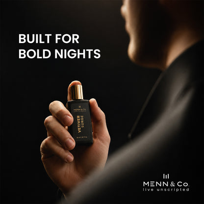 Hand holding a Menn & Co perfume bottle with 'Built for Bold Nights' text on a dark background