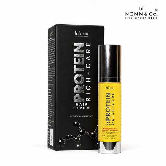 A bottle of foli-cul Protein Rich-Care Hair Serum with a bright yellow label and silver cap, standing next to its black packaging box on a white background. The brand 'foli-cul' is visible on both the box and bottle, and a logo for 'Menn & Co' is in the top right corner.