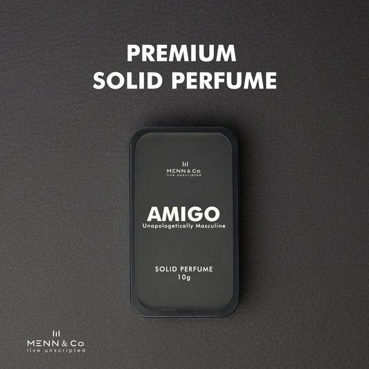Amigo solid perfume container with 'Menn & Co' branding on a gray background