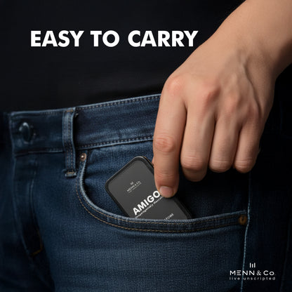 Hand inserting a black AMIGO Solid Perfume into a jeans pocket with 'EASY TO CARRY' text above.