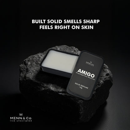Amigo Solid perfume bar and packaging on a dark background with text about the product's qualities.