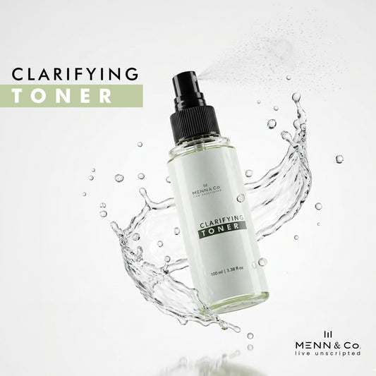 Menn & Co clarifying toner bottle with water splash on a light background