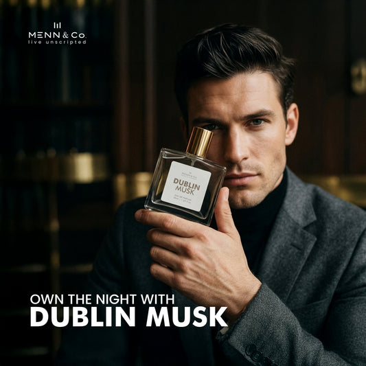 Man holding a Menn & Co Dublin Musk perfume bottle with Menn & Co branding.