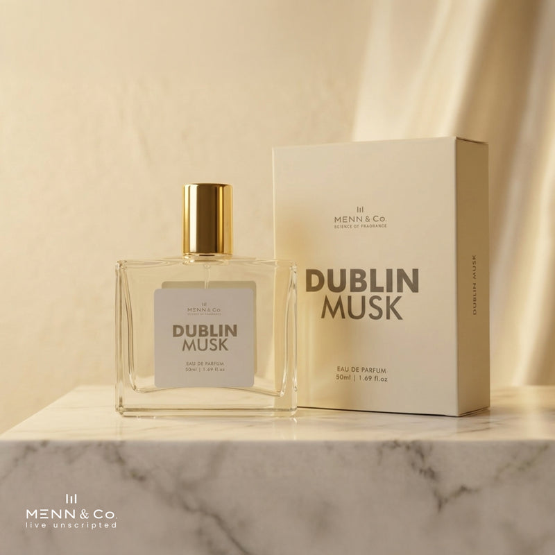 Menn & Co Dublin Musk perfume bottle and packaging on a marble surface with a beige background.
