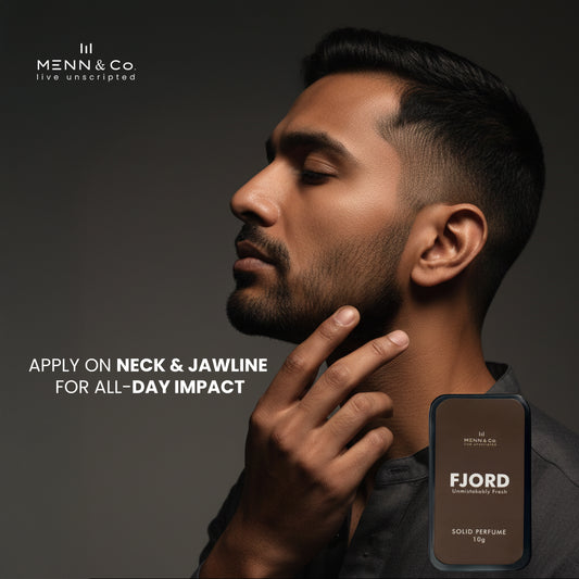 Man applying Fjord solid perfume on neck with Menn & Co branding