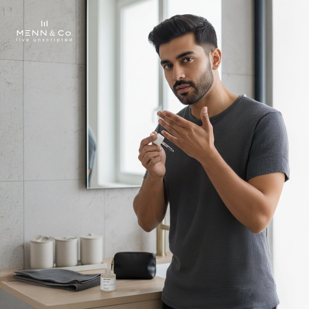 Man applying Korean Skin Brightening Face Serum  in a bathroom with Menn & Co branding.