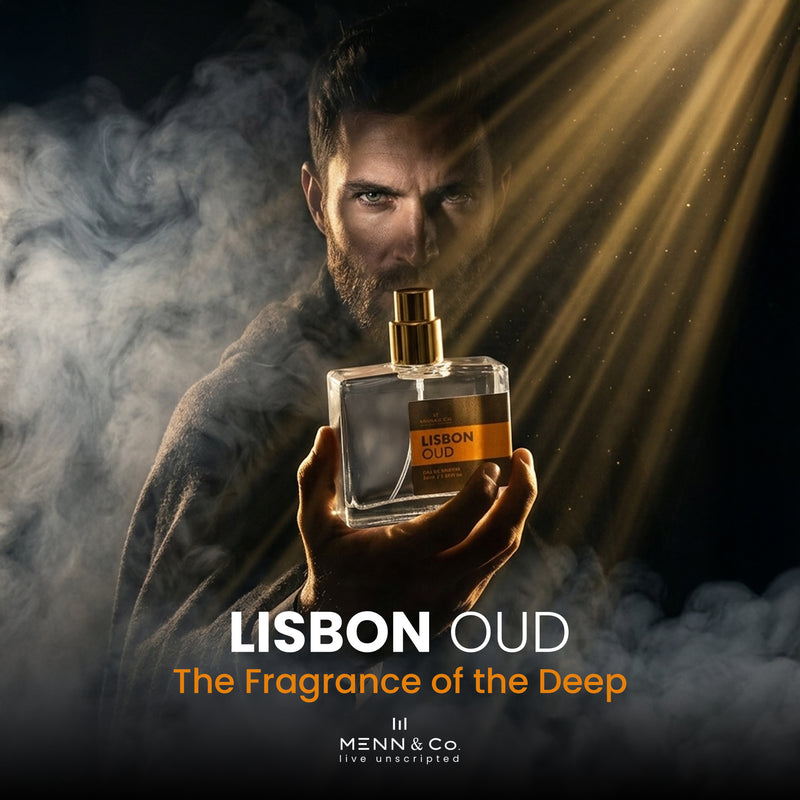 Man holding a 'Lisbon Oud' perfume bottle with smoke and light effects