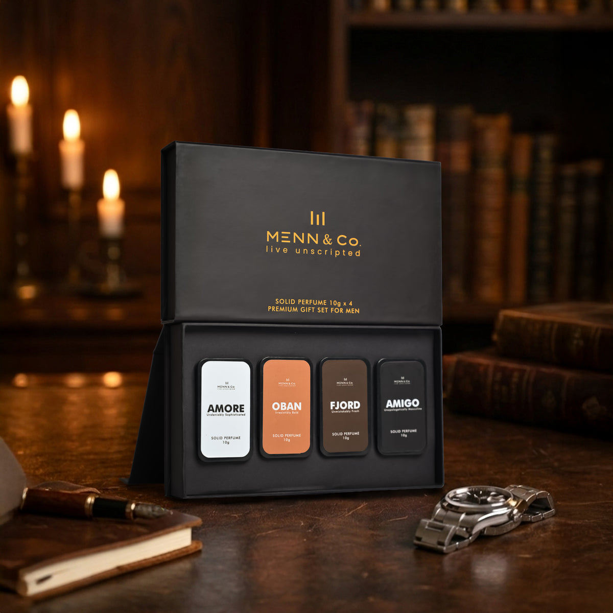 Menn & Co solid perfume Amore, Amigo, Oban, Fjord set on a wooden surface with candles and books in the background