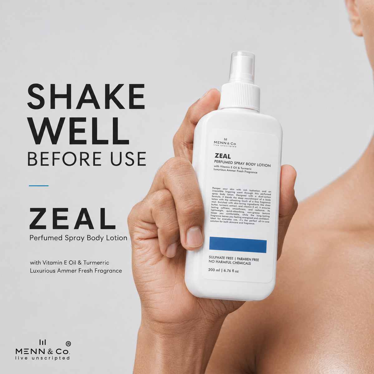 A person holds a white bottle of Menn & Co Zeal Perfumed Spray Body Lotion against a light gray background, with promotional text on the left reading 'SHAKE WELL BEFORE USE' and 'ZEAL Perfumed Spray Body Lotion'.