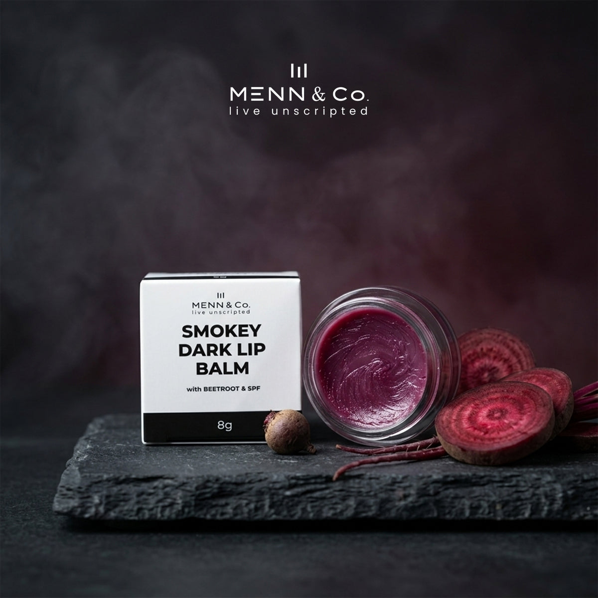 Menn & Co Smokey Dark Lip Balm with beetroot and SPF on a dark background