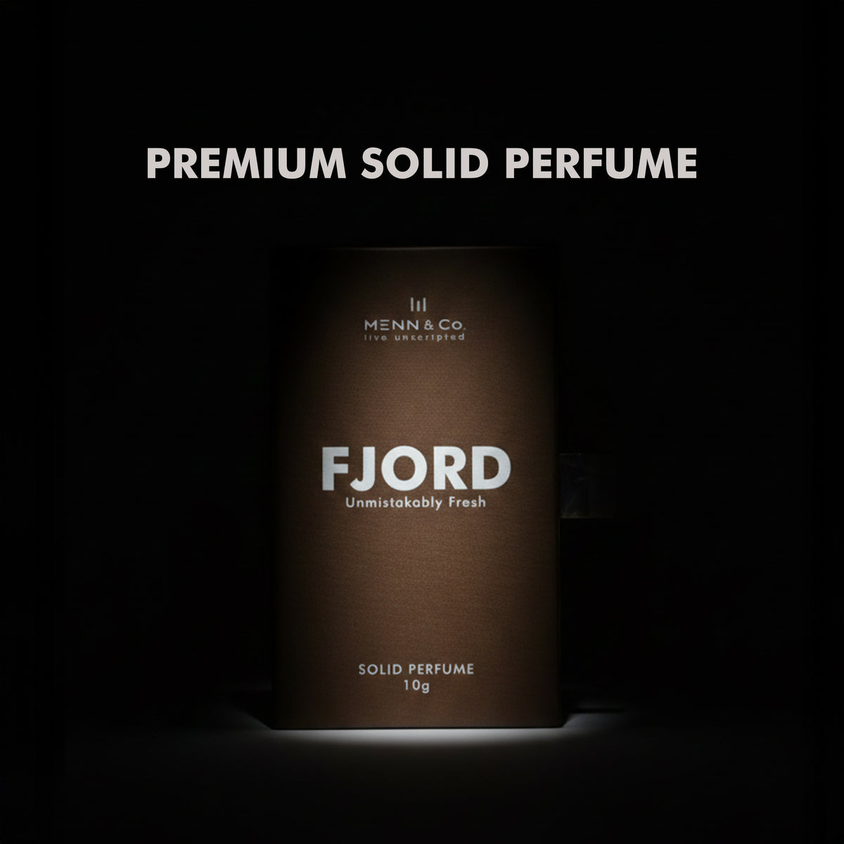 Menn & Co Fjord solid perfume packaging on a dark background
