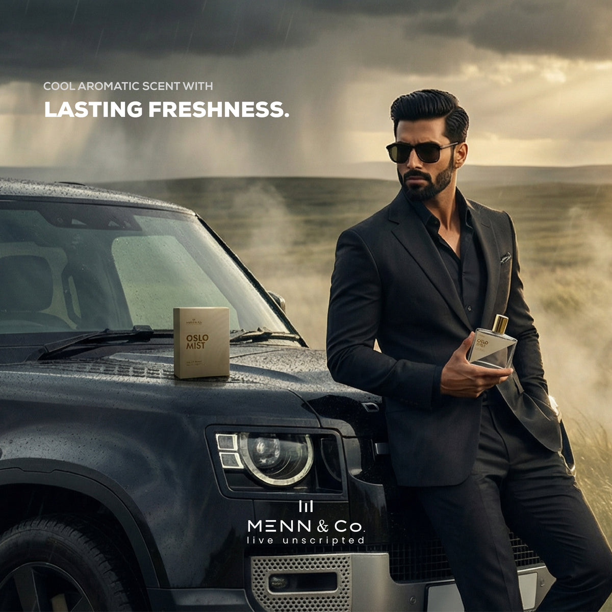 Man in a suit holding a bottle of Menn & Co. Oslo Mist perfume next to a car with stormy background