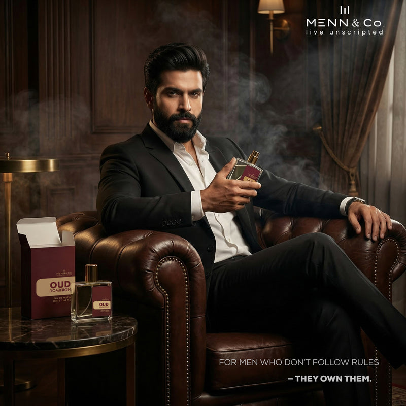 Man in a suit holding a Oud Dominion perfume bottle in a luxurious room with 'Menn & Co' branding.