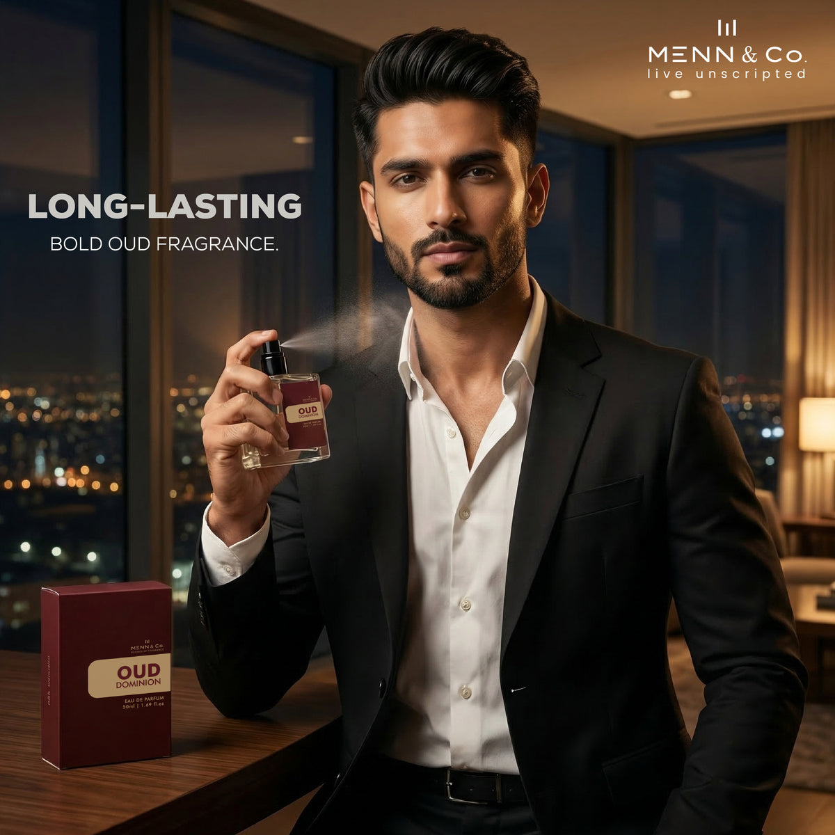 Man in a suit holding Menn & Co Oud Dominion perfume bottle with 'Menn & Co' branding and 'Long-Lasting Bold Oud Fragrance' text.