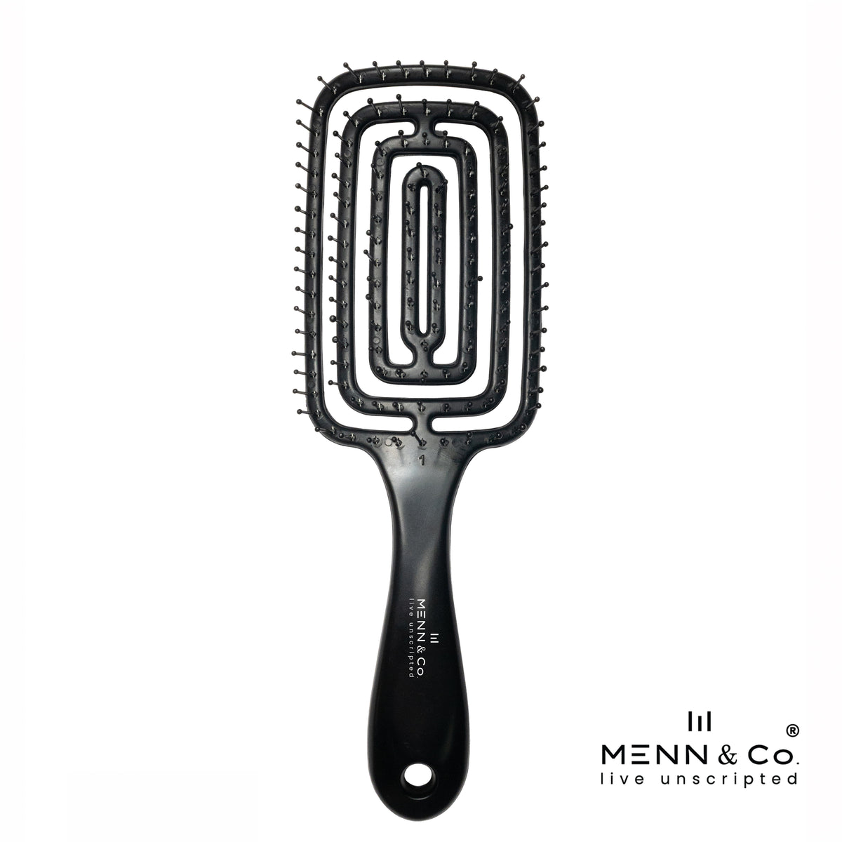 A black paddle hairbrush with a unique rectangular, concentric-oval bristle design, shown on a solid white background with the Menn & Co logo in the bottom right corner.