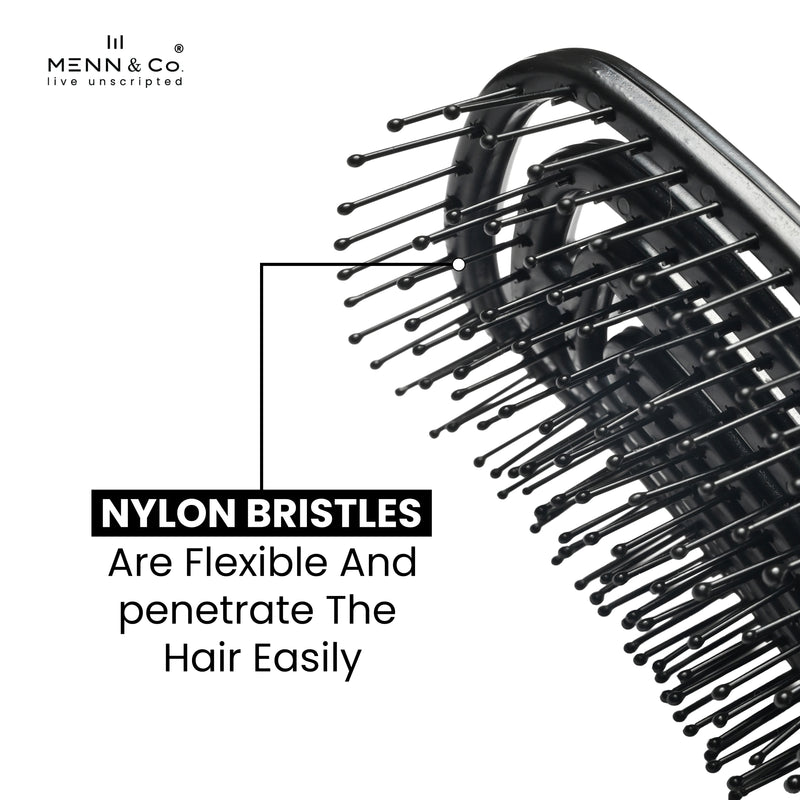 Close-up of a black hairbrush with flexible nylon bristles on a white background, with text reading 'NYLON BRISTLES Are Flexible And penetrate The Hair Easily' and the Menn & Co logo in the top left.