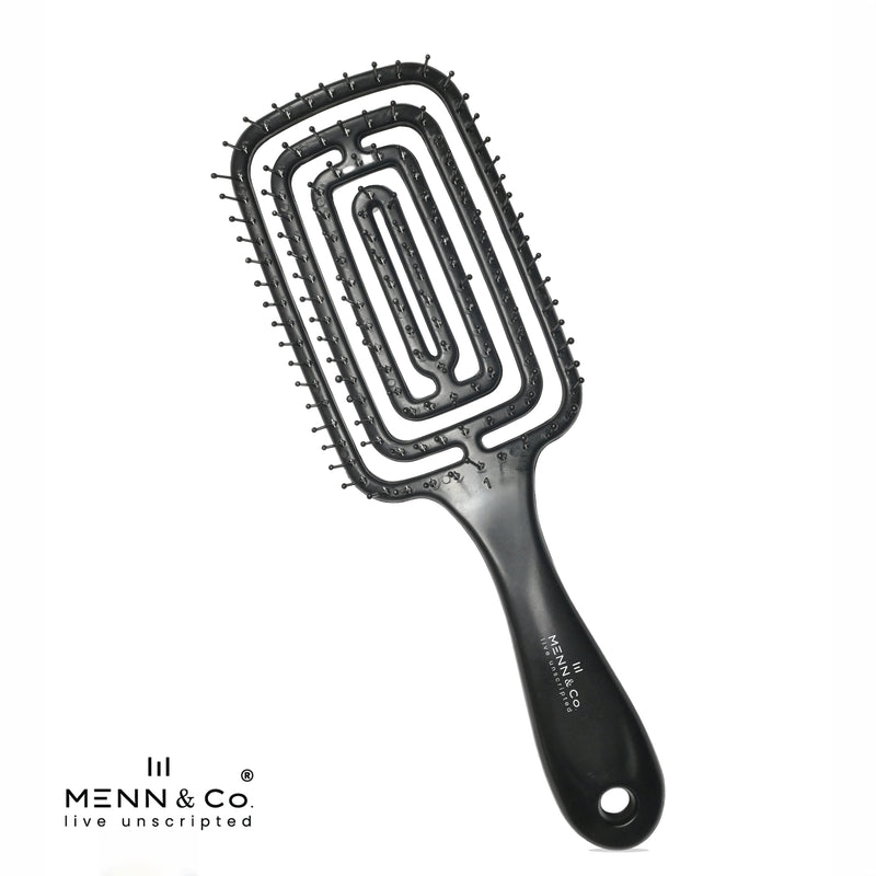 A black hairbrush with a rectangular head, ridged bristles, and a contoured handle, shown on a white background with the MENN & Co logo in the bottom-left corner.