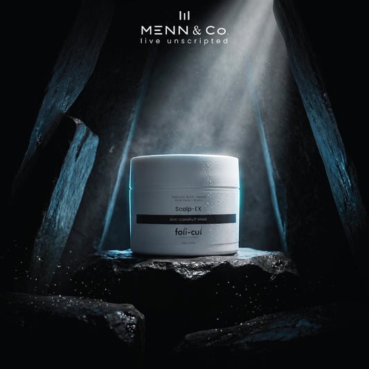 Box of Menn & Co. product in a dark, cave-like setting with dramatic lighting.