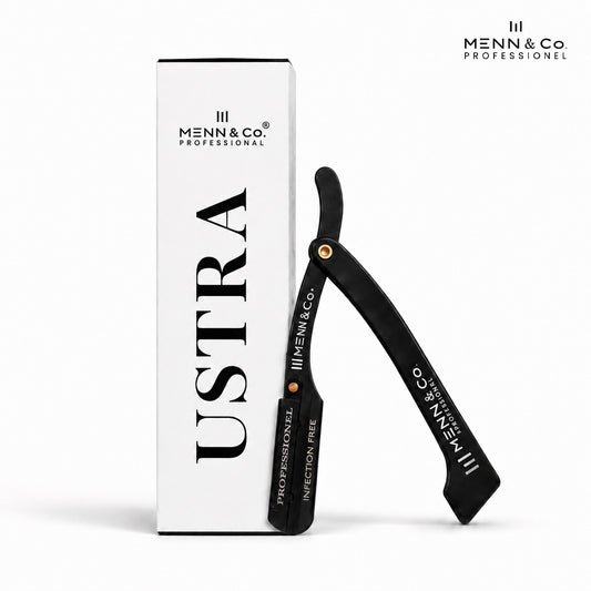 A black straight razor with gold accents stands beside its white retail box, both branded Menn & Co Professional. The box features the word 'Ustra' in large black letters, and the razor is labeled 'PROFESSIONAL' and 'INJECTION FREE'.