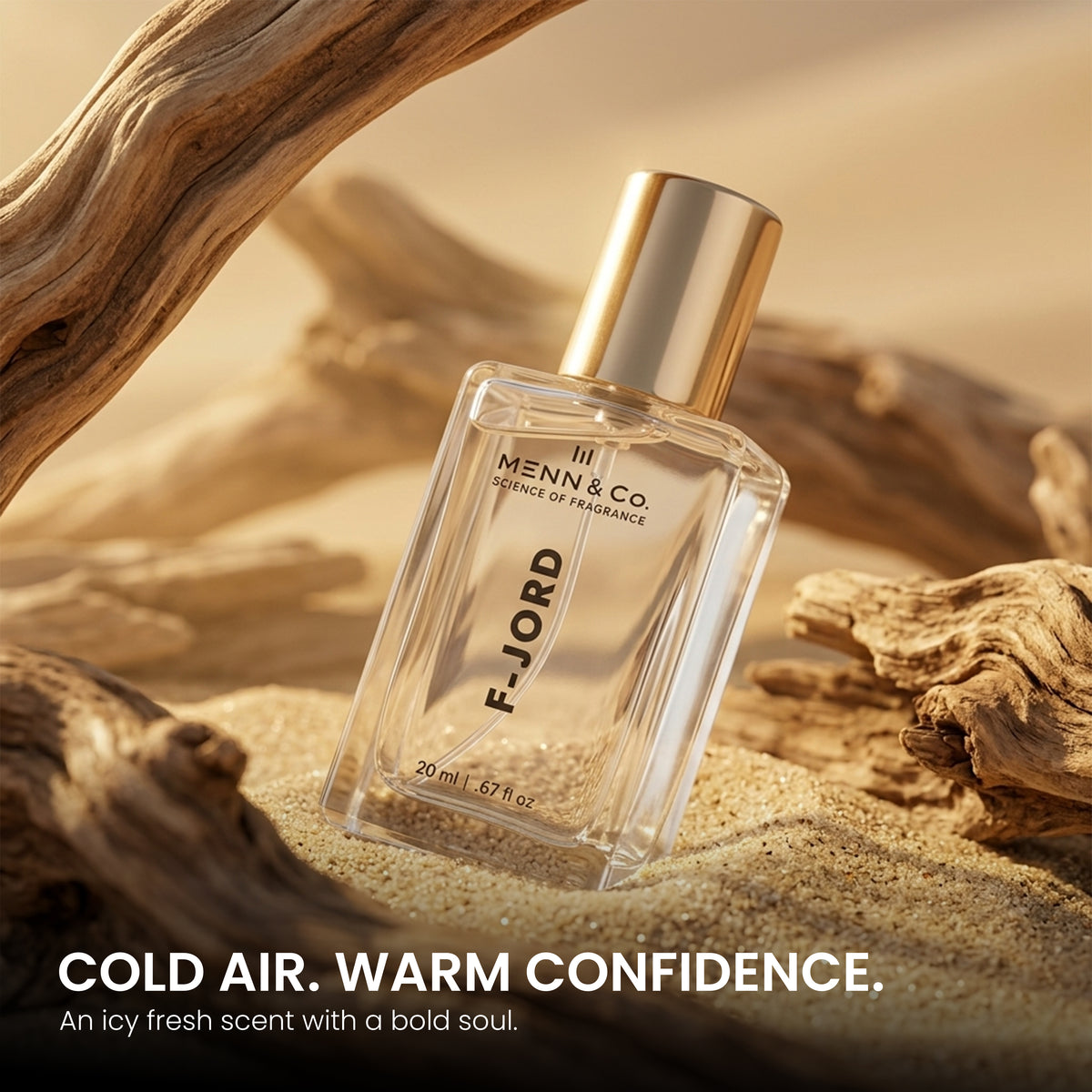 FJORD perfume bottle on sand with driftwood, featuring Menn & Co. branding.