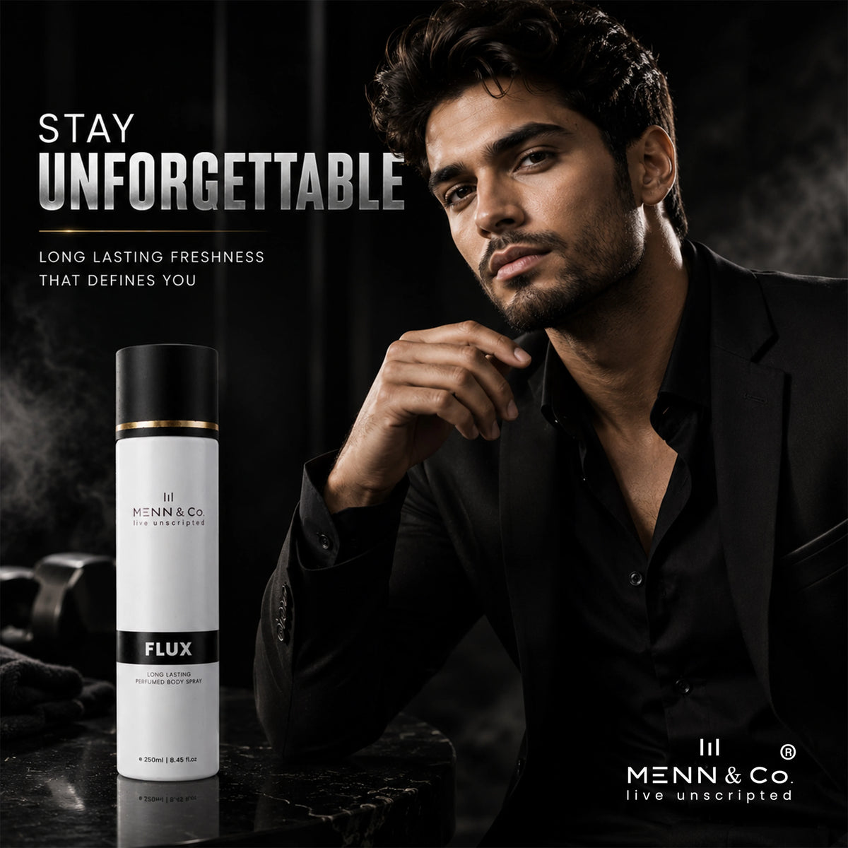 Man in a black suit with a bottle of Menn & Co Flux cologne on a dark background