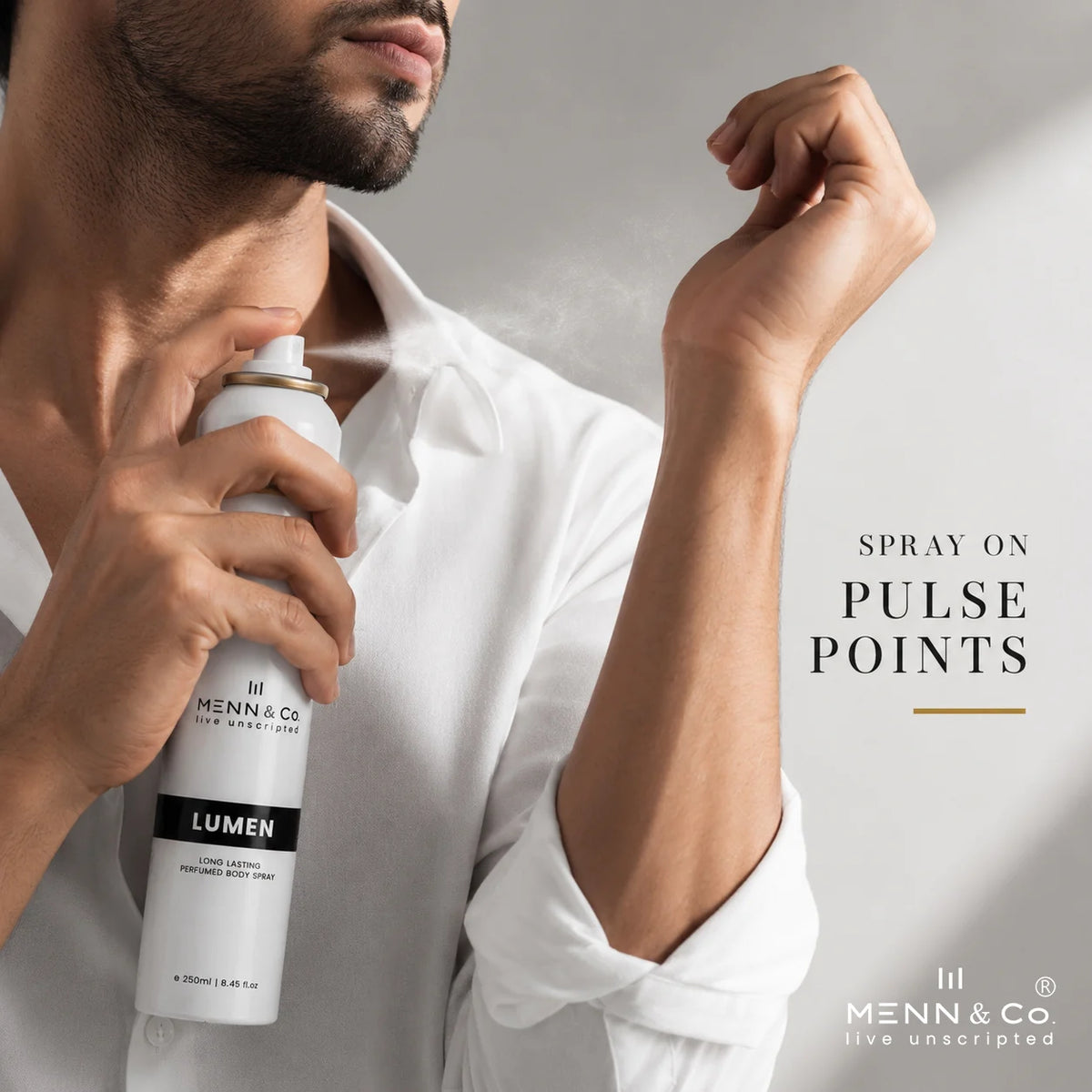 Man applying Menn & Co Lumen spray to his neck with a neutral background