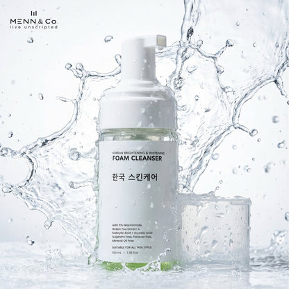 Menn & Co Korean Brightening & Whitening Foam Cleanser bottle with its cap beside it, set against a dynamic water splash background.