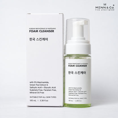 Menn & Co Korean Brightening & Whitening Foam Cleanser shown with its white packaging box and a clear pump bottle containing pale yellow-green liquid, on a clean white background.