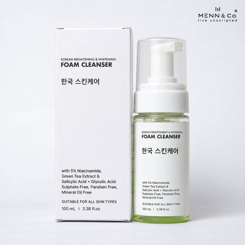 Menn & Co Korean Brightening & Whitening Foam Cleanser shown with its white packaging box and a clear pump bottle containing pale yellow-green liquid, on a clean white background.